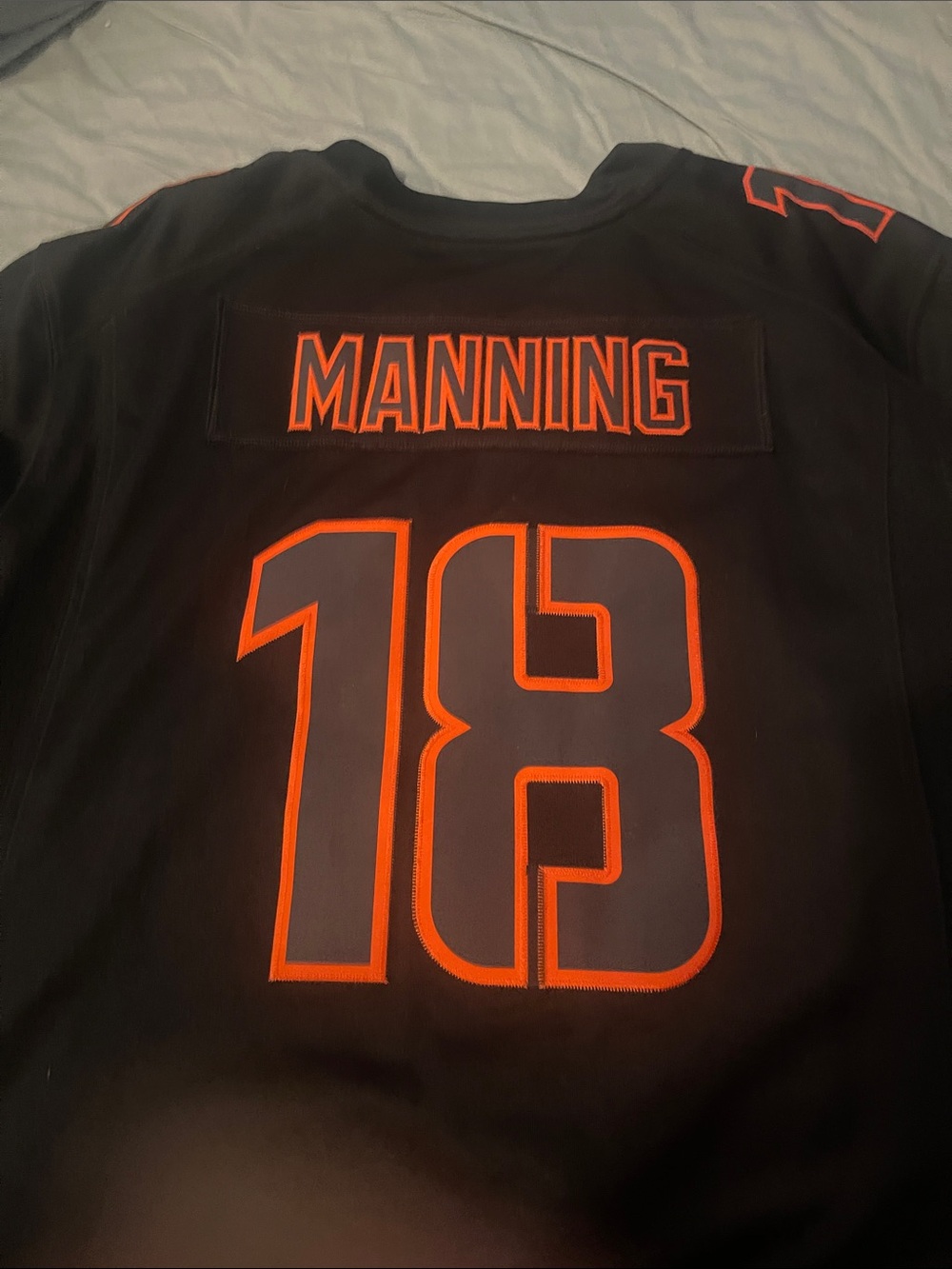 NFL Black Jersey with Orange Number 18